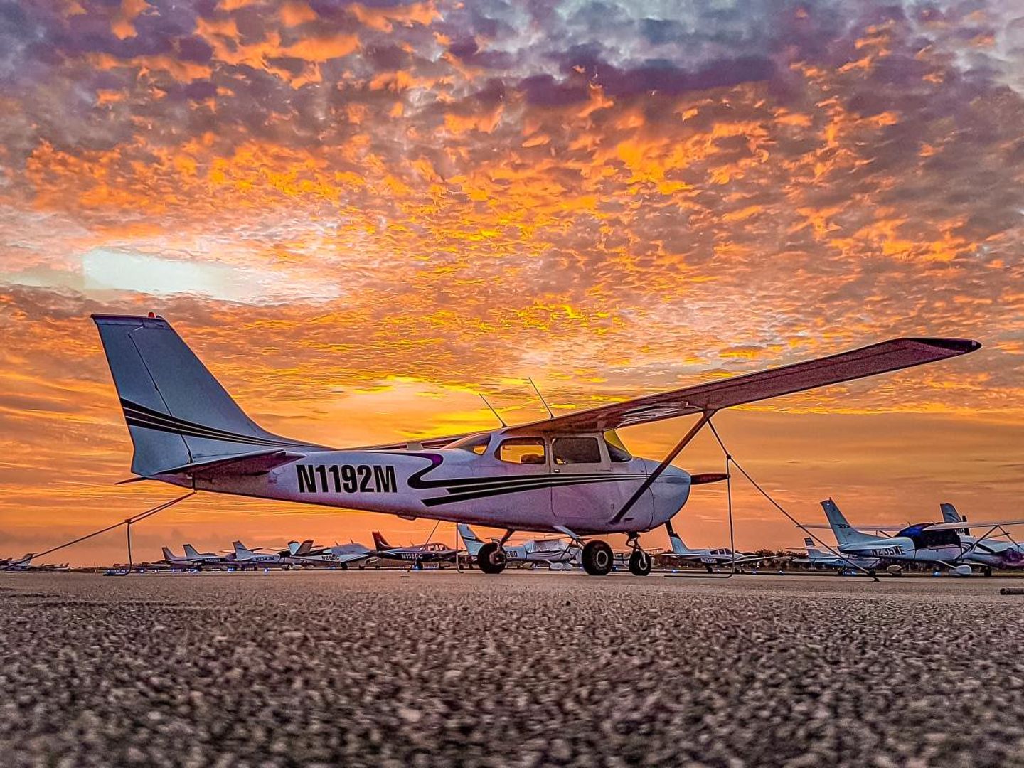 Plane on ground at sunset