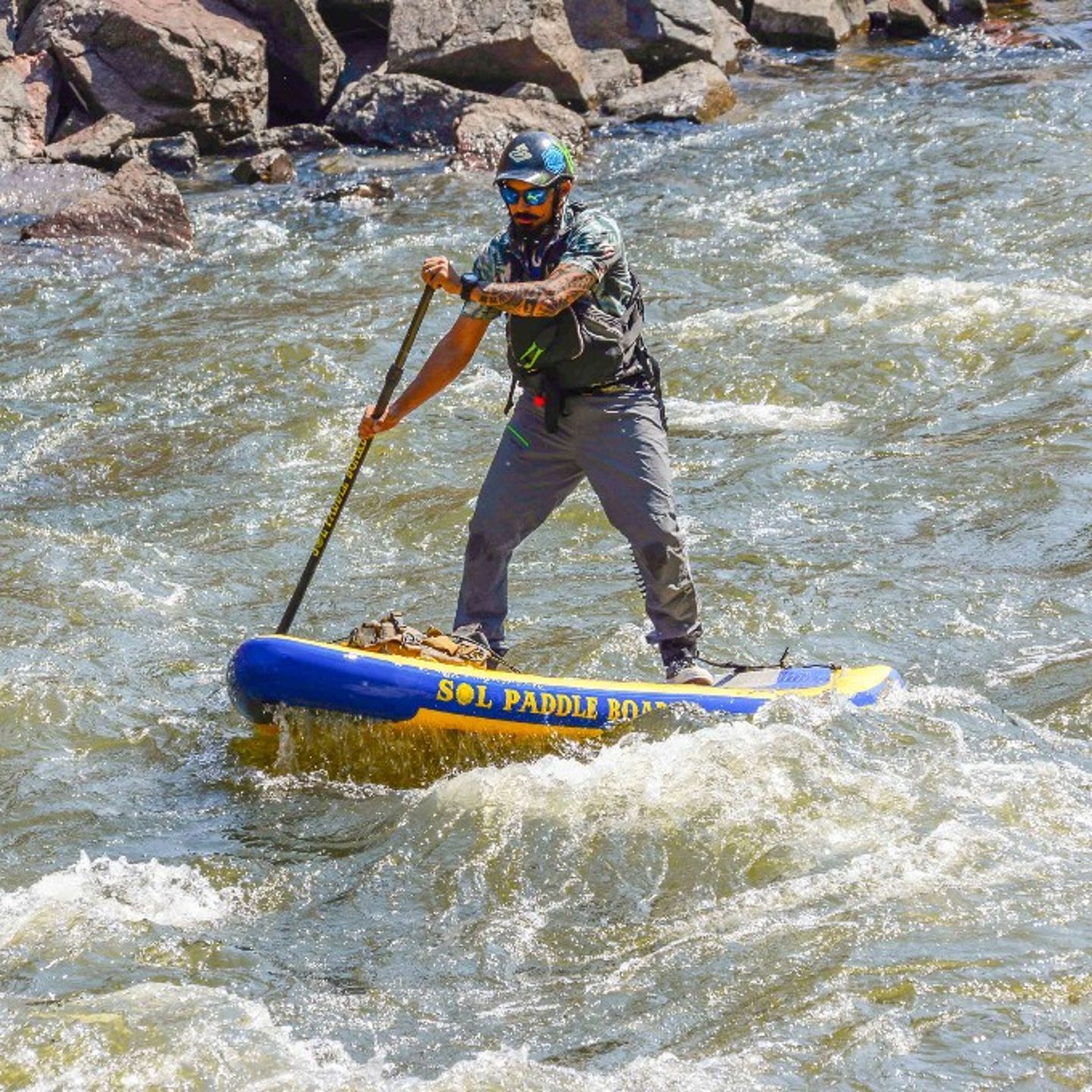 Person paddling in rapid