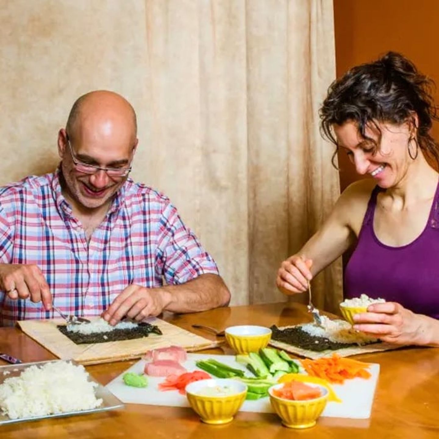 Two people making rolls