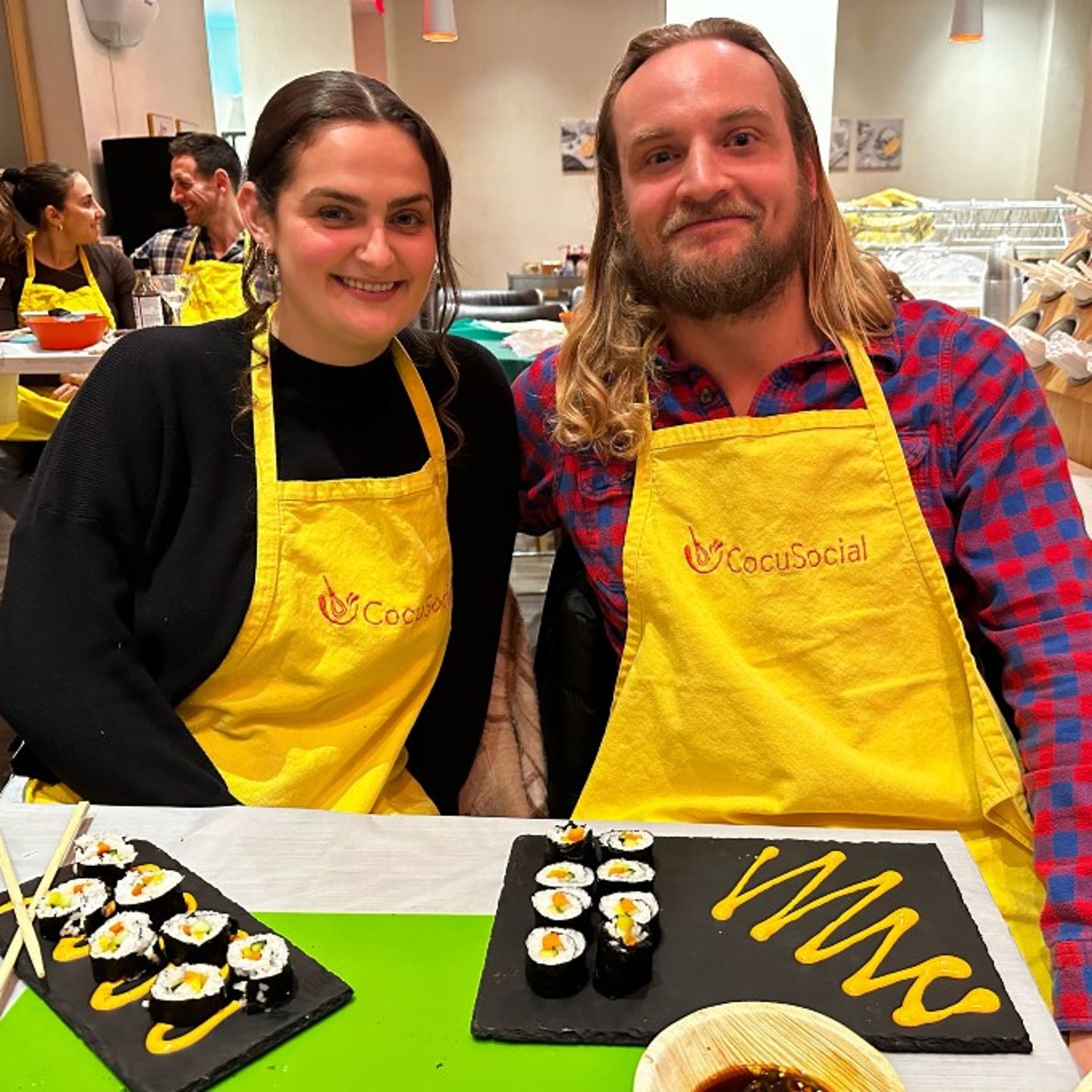 Couple Posing with Sushi Rolls