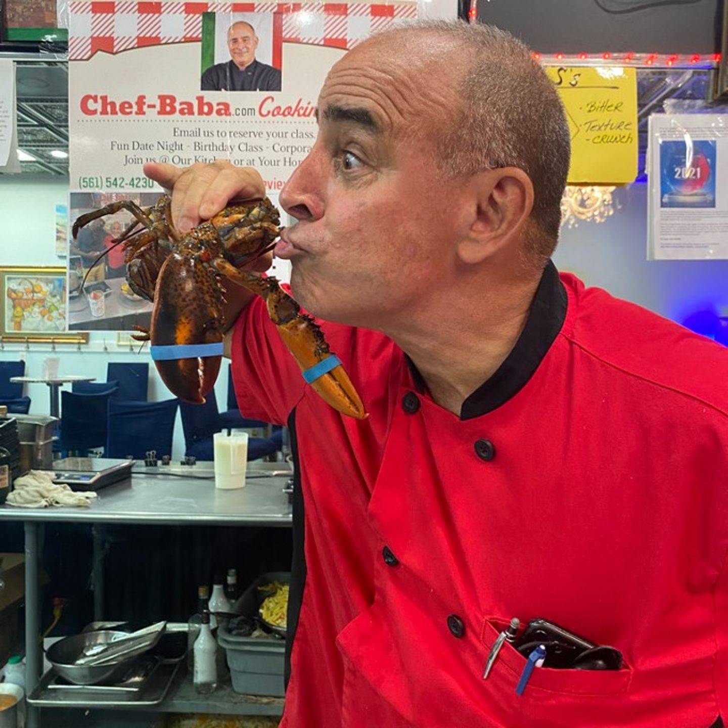 Chef Kissing a Lobster