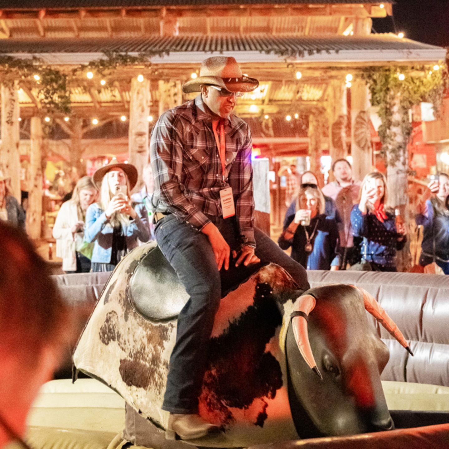 Person riding mechanical bull