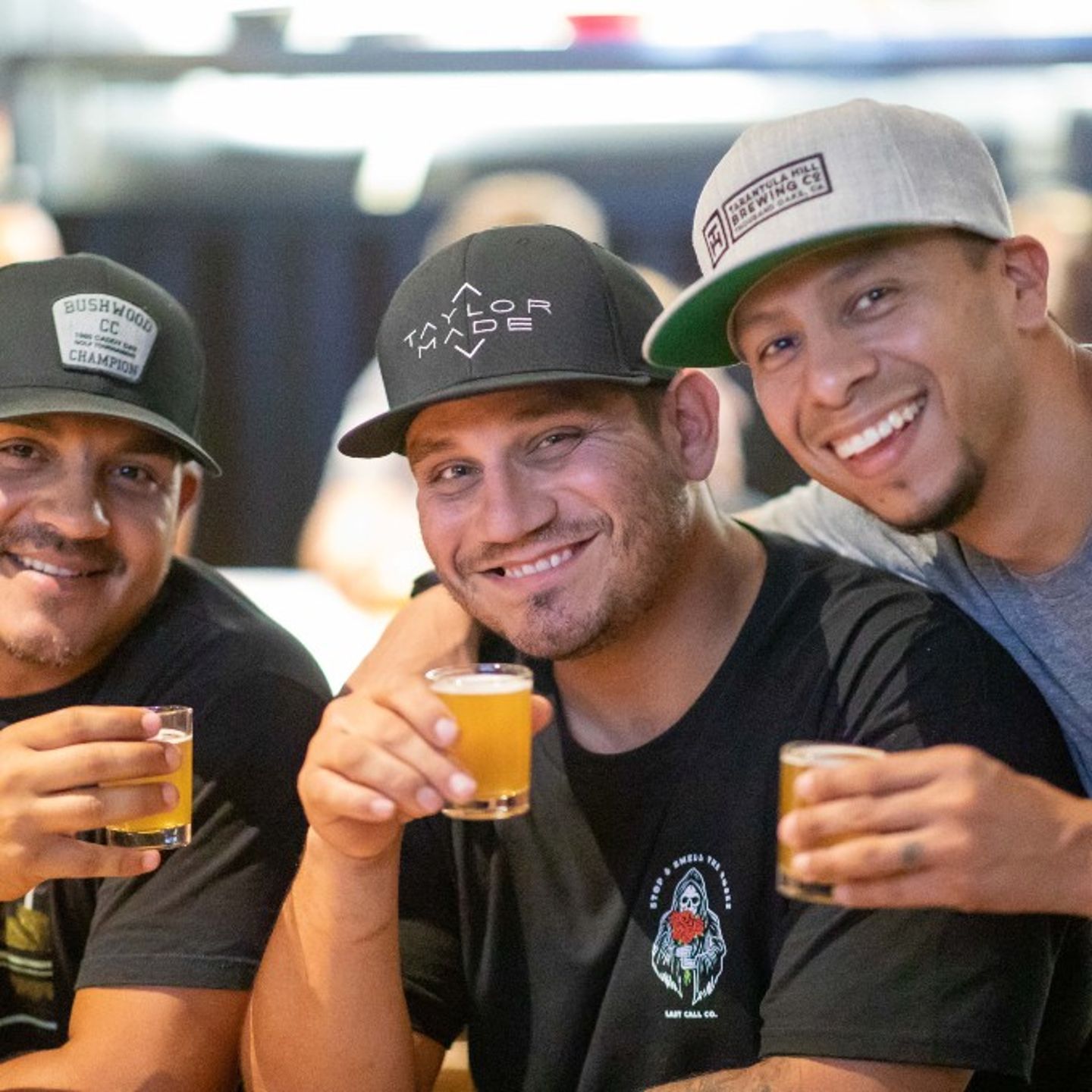 Three men with drinks