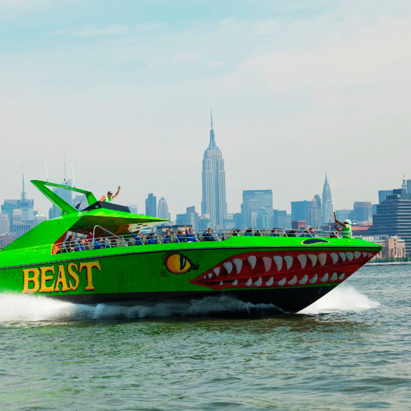Boat in front of city 