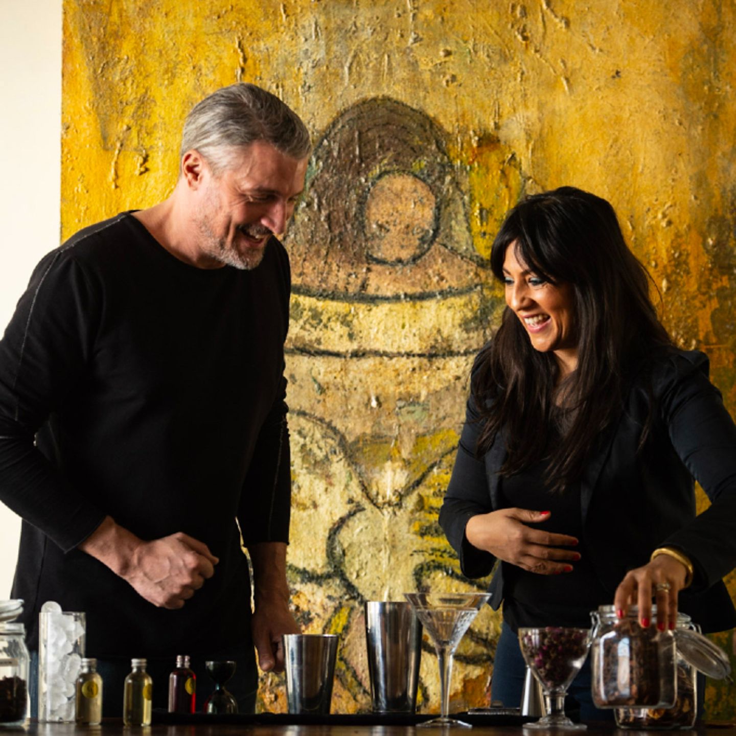 Two people crafting cocktails
