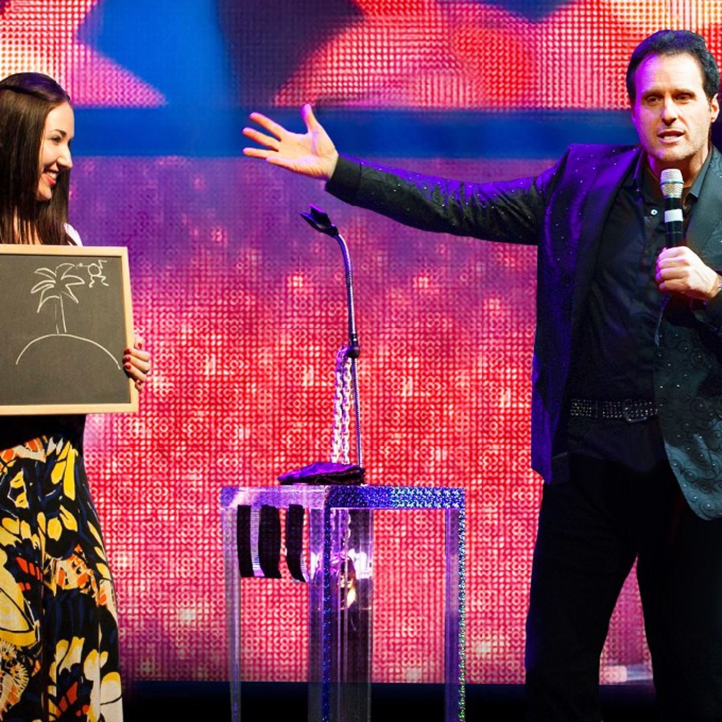 Man on stage with woman