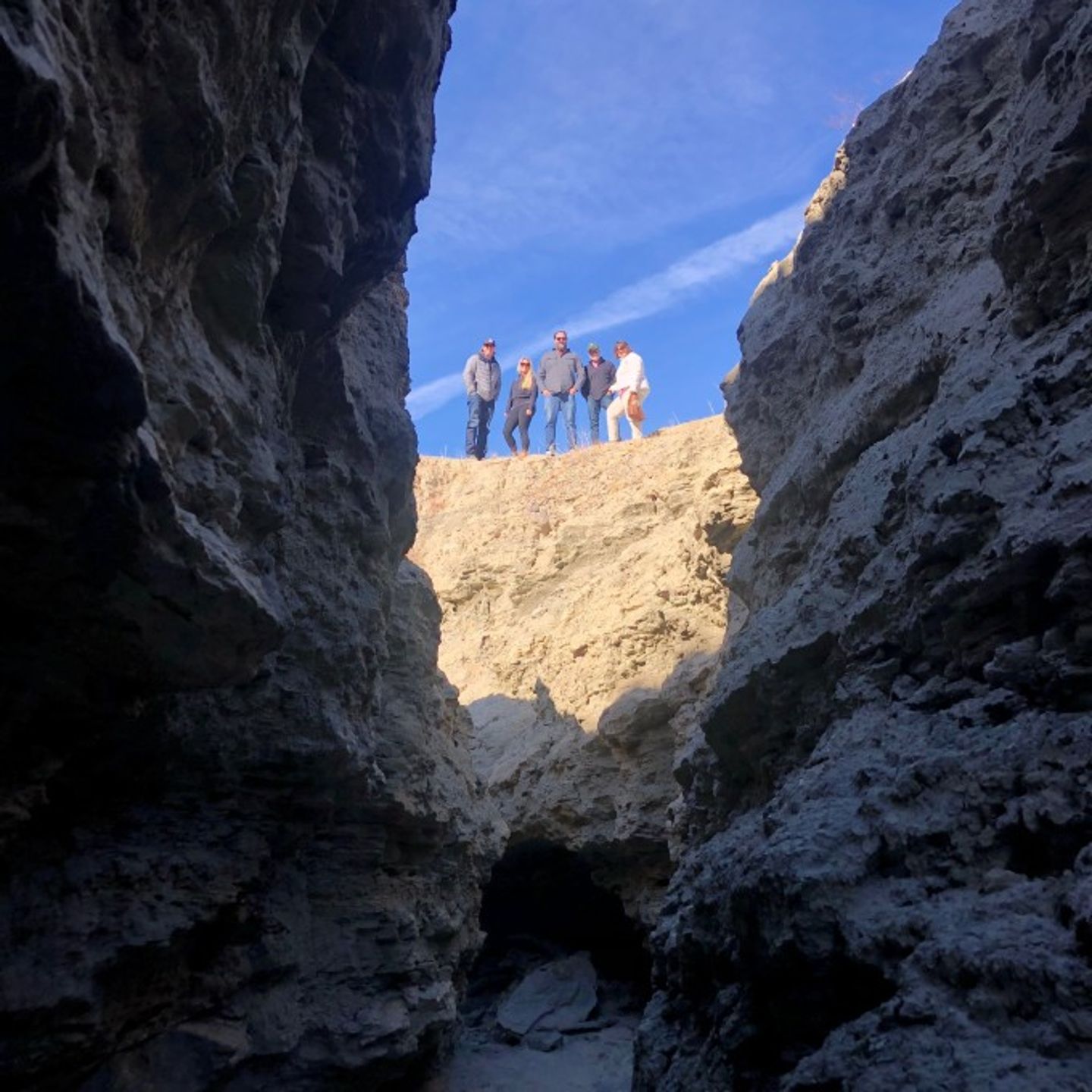 Group posing about fault line