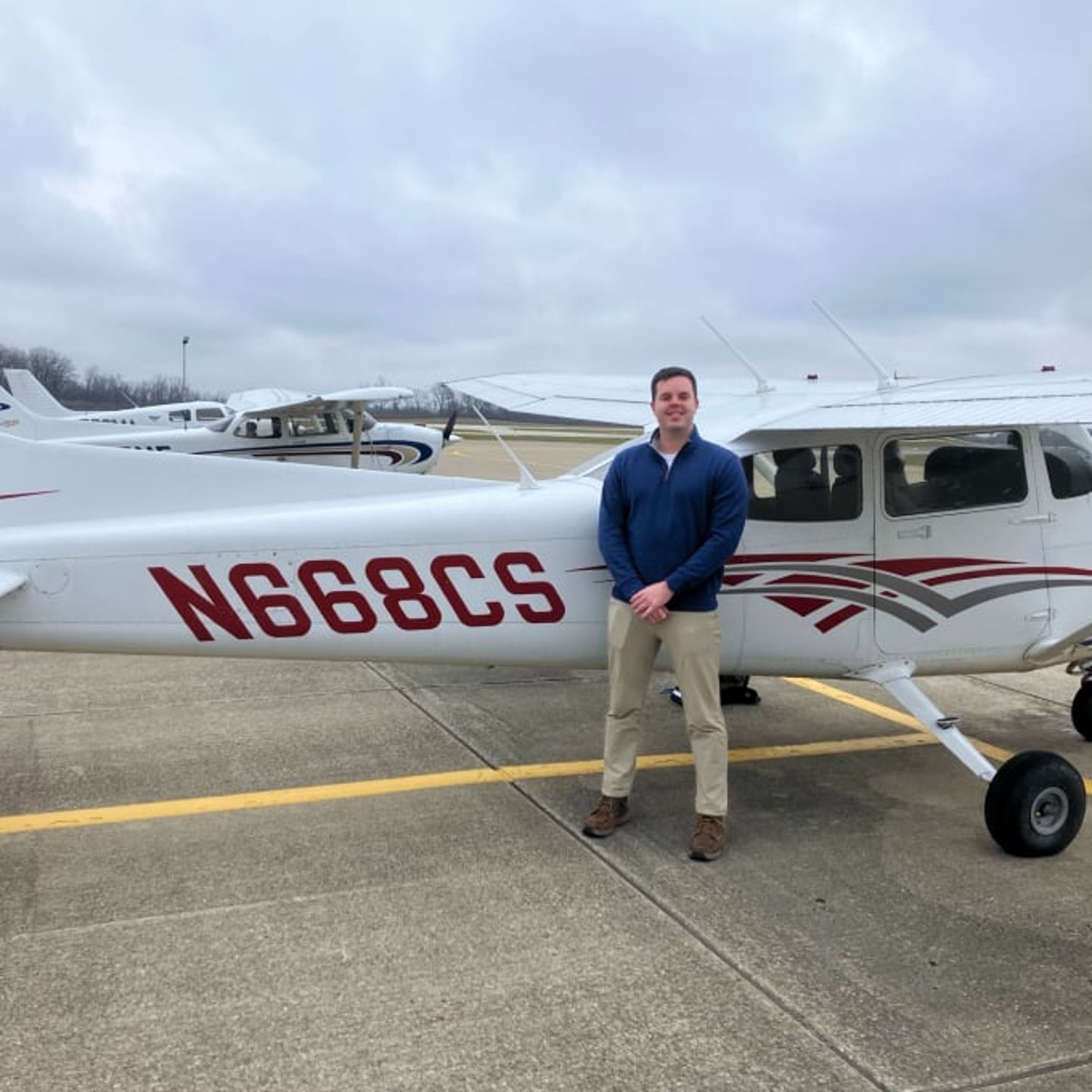 Man standing next to plane