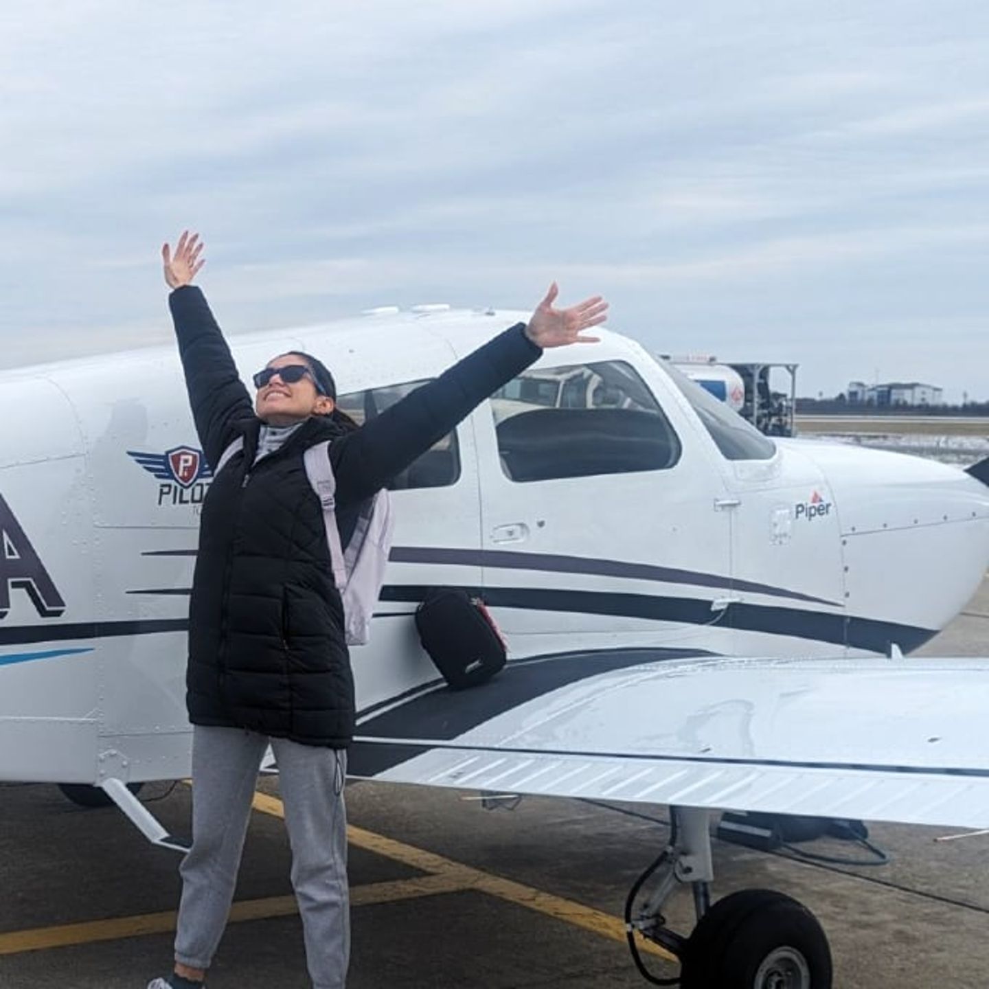 Woman next to plane