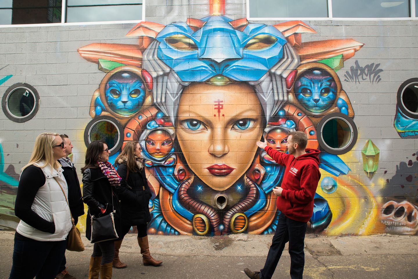 Group in front of mural