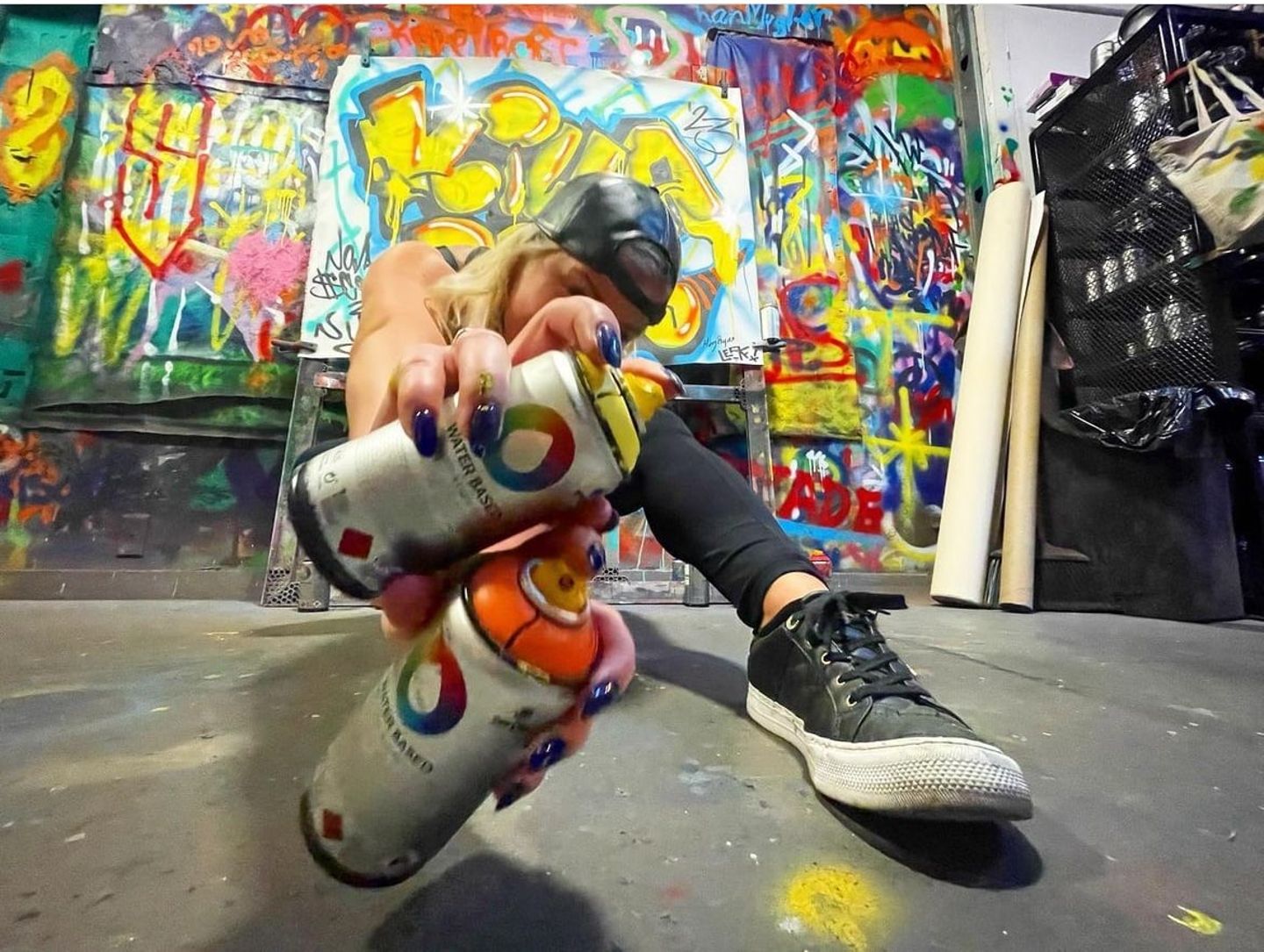 Woman with spray cans