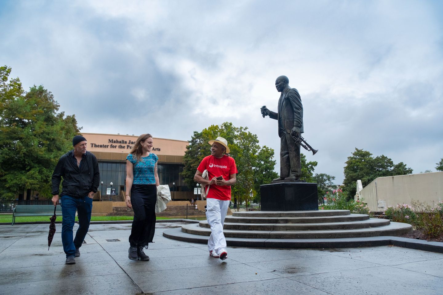 Group walking by statue