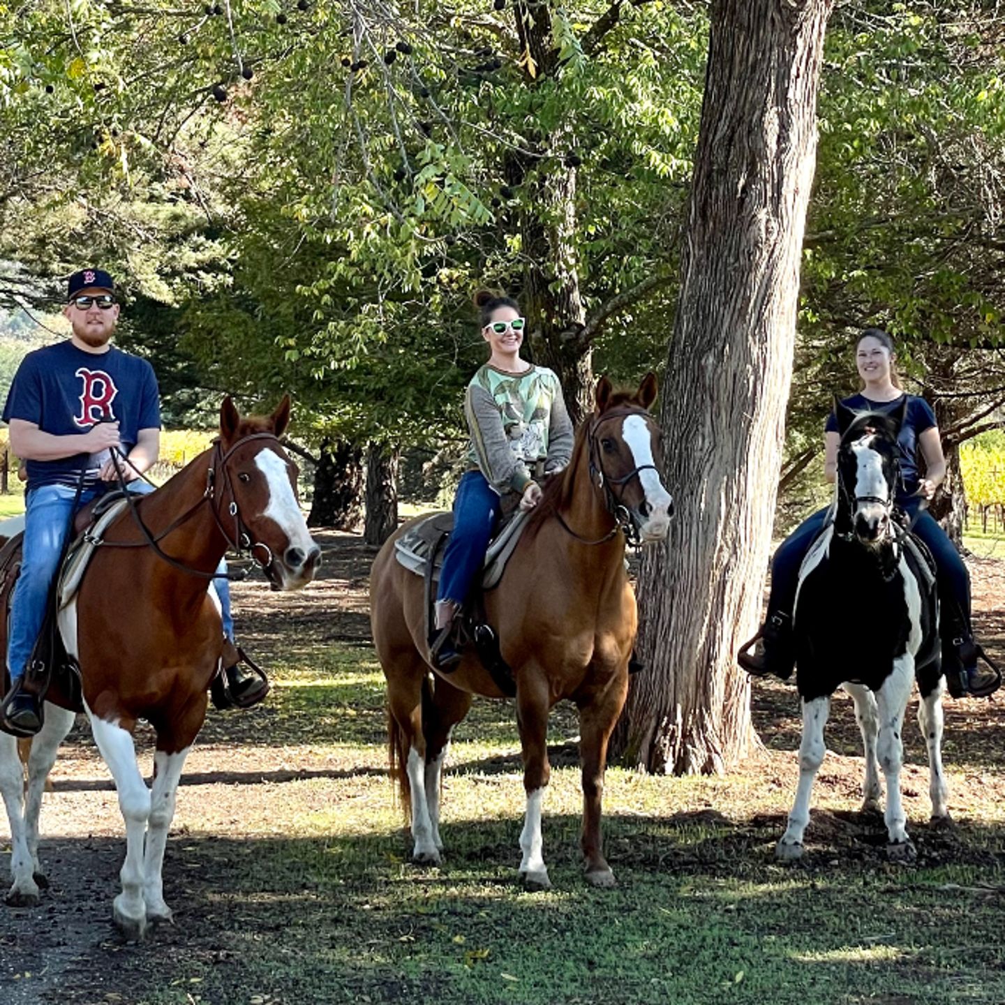 Three people on horses