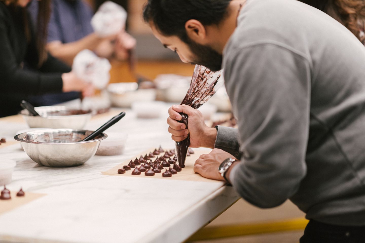 Person piping truffles