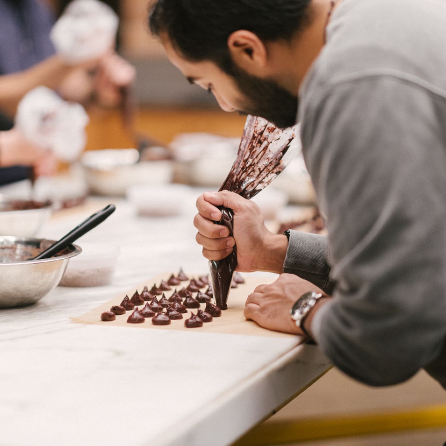 Person piping truffles