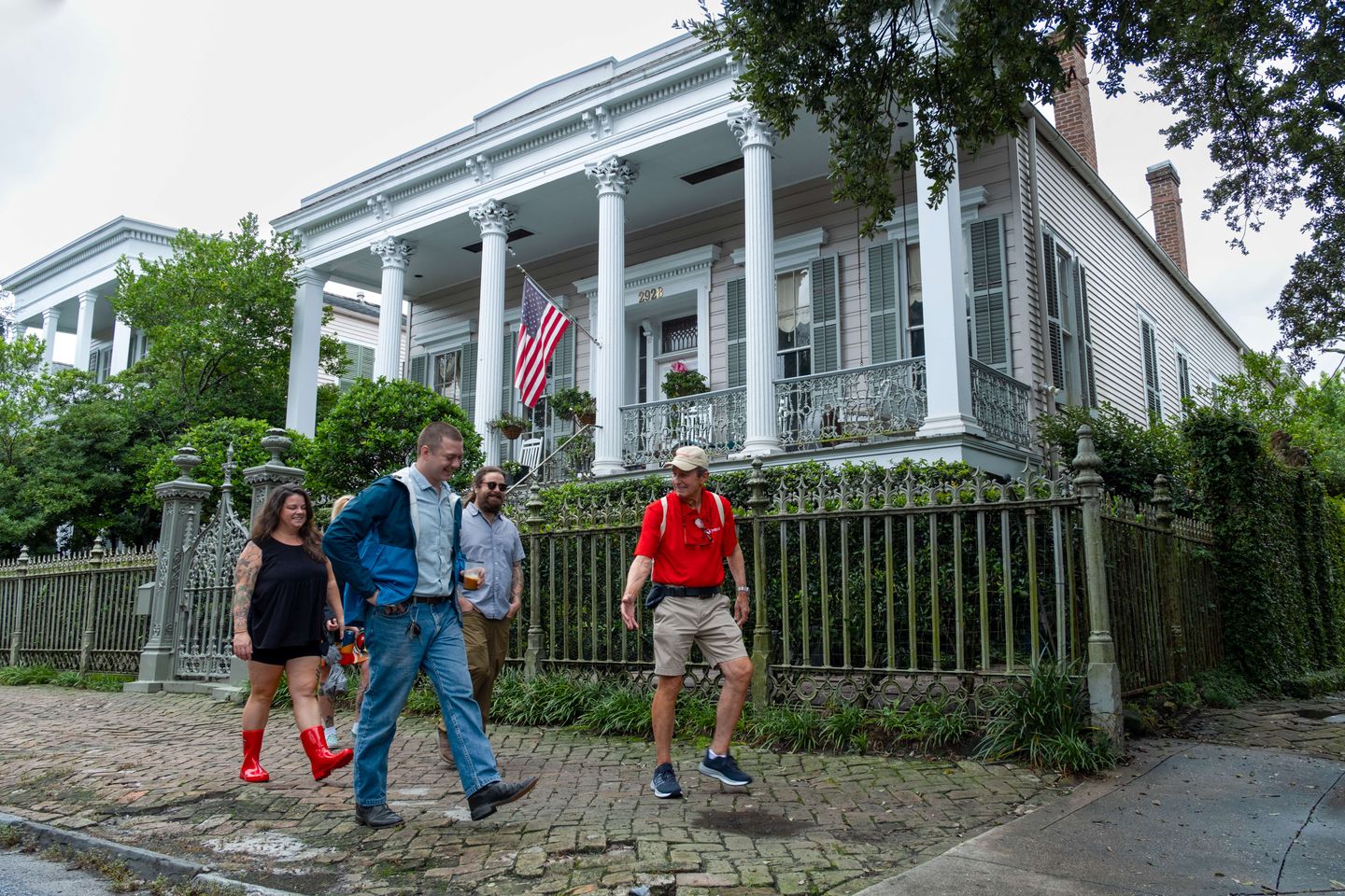 Group walking by house
