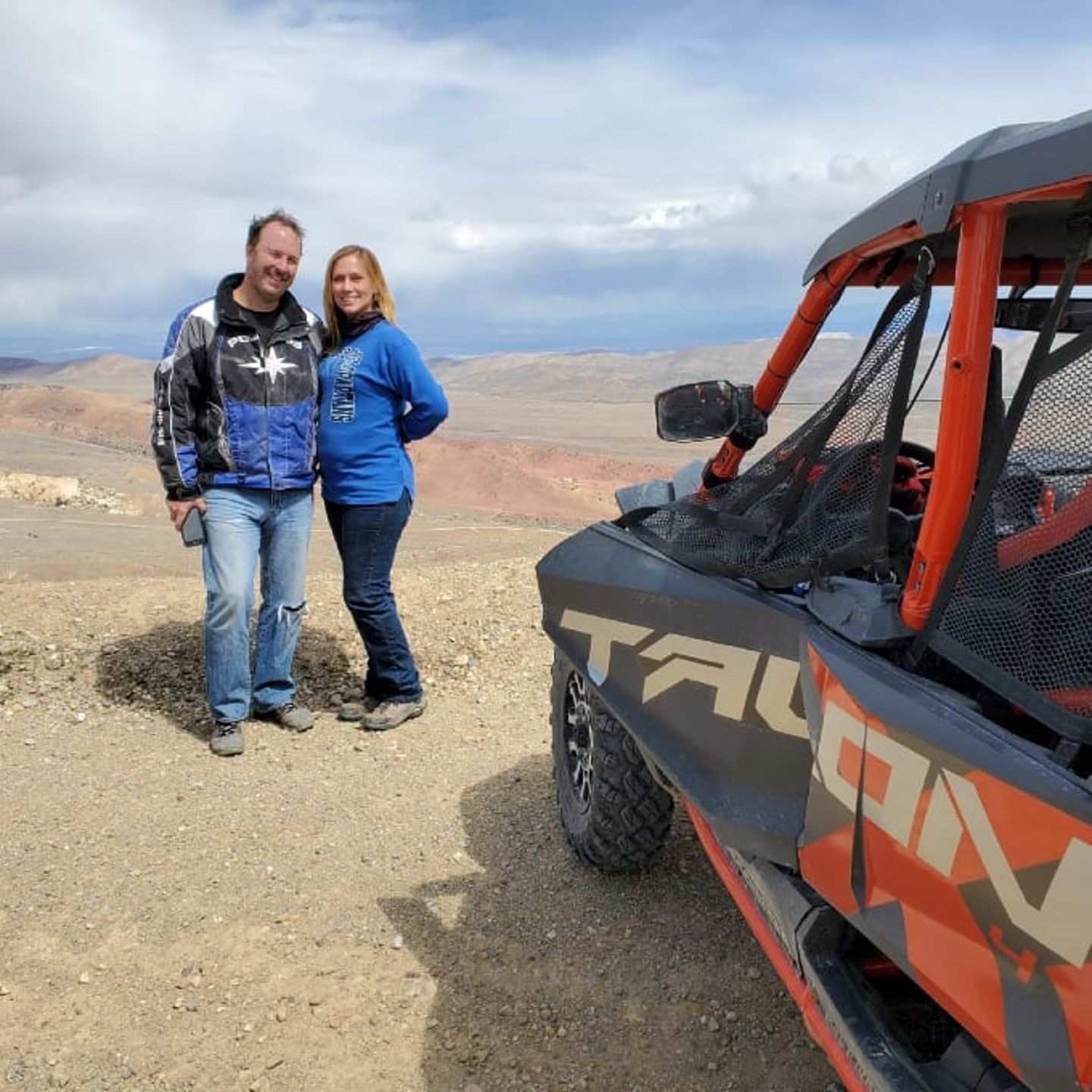 Couple posing with UTV