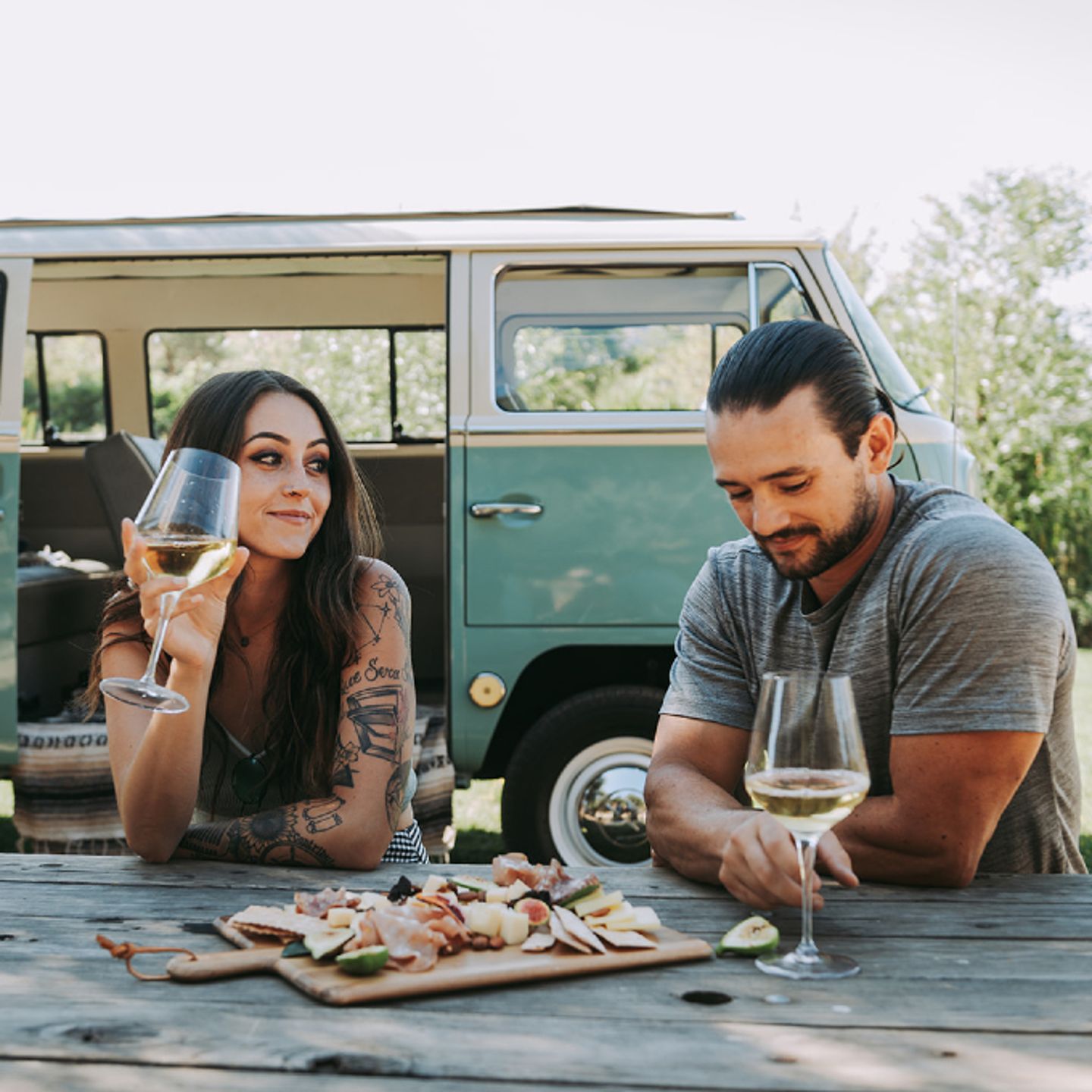 Couple enjoying wine and charcuterie board