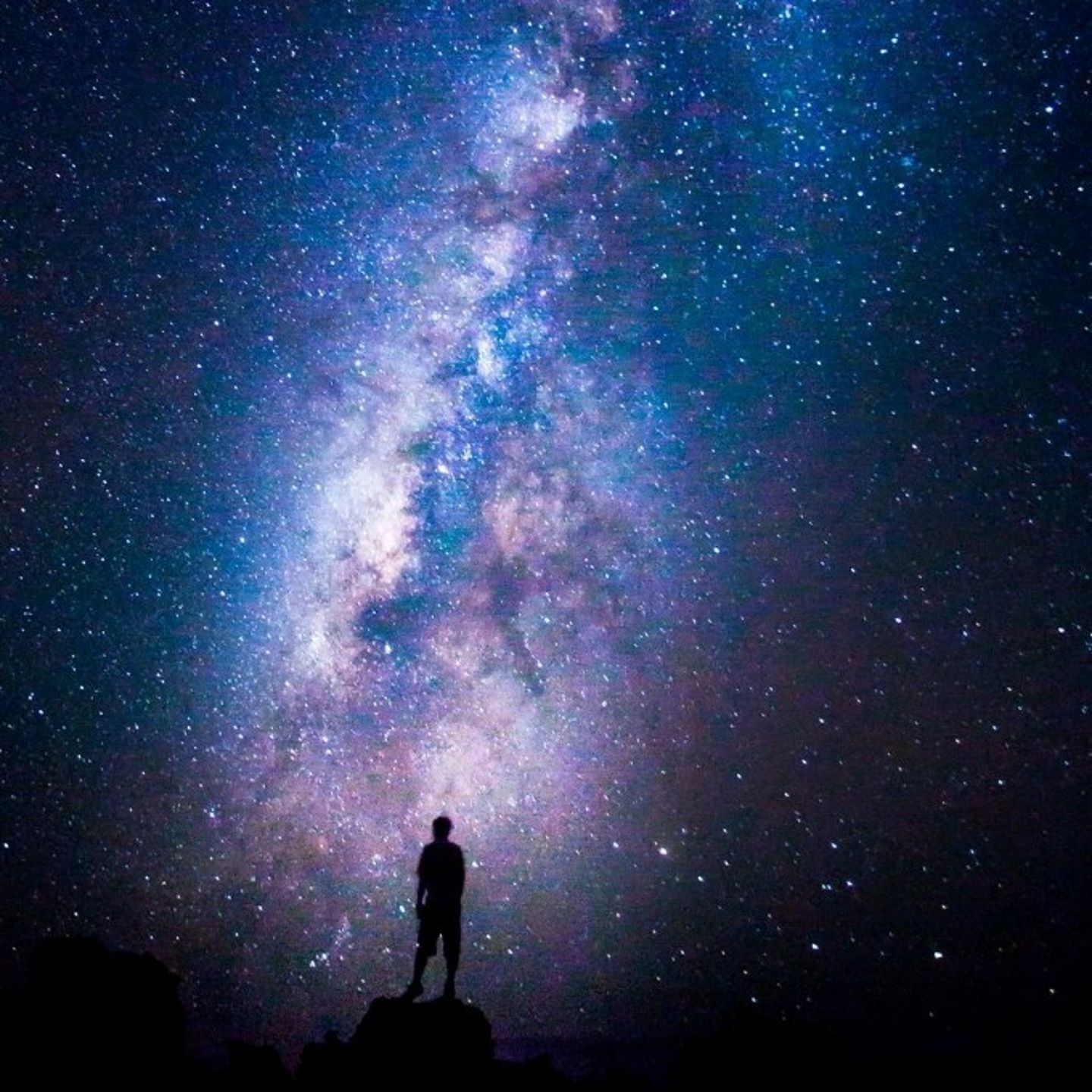 Person Standing in Star Filled Sky