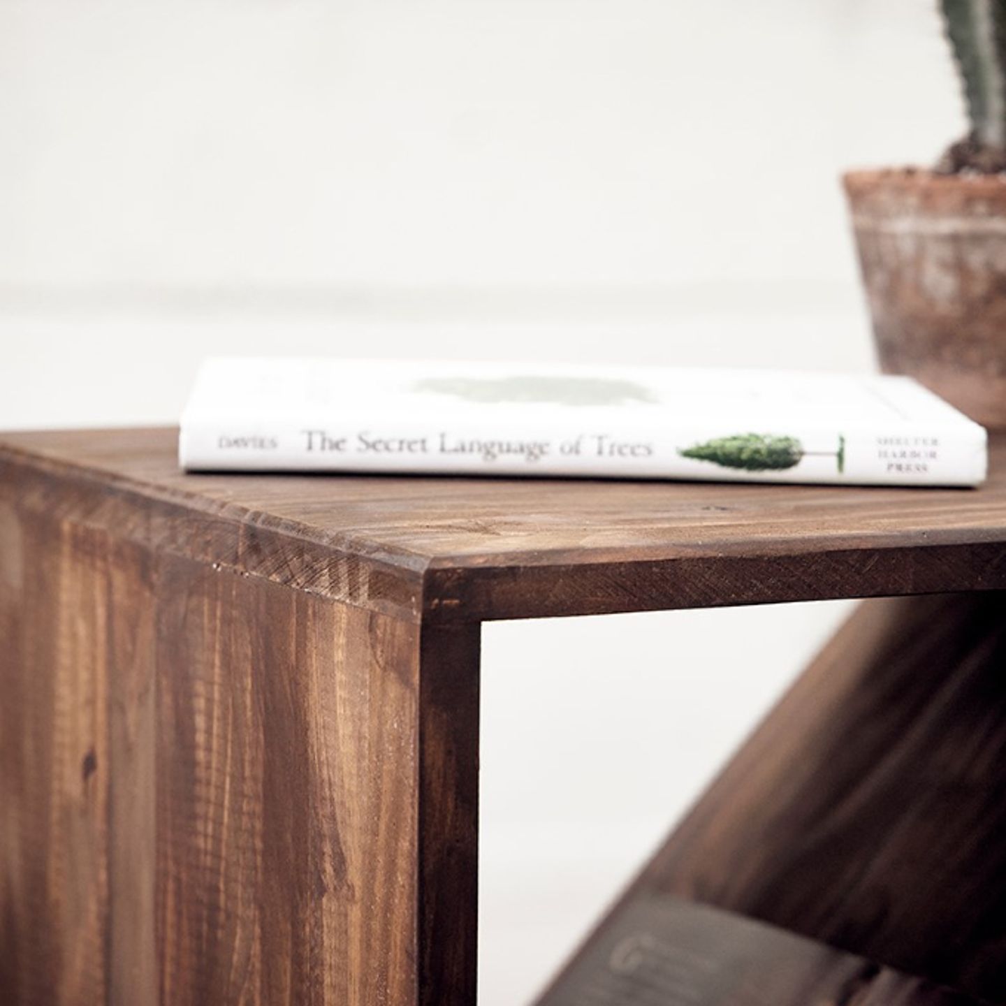 Wedge table holding book