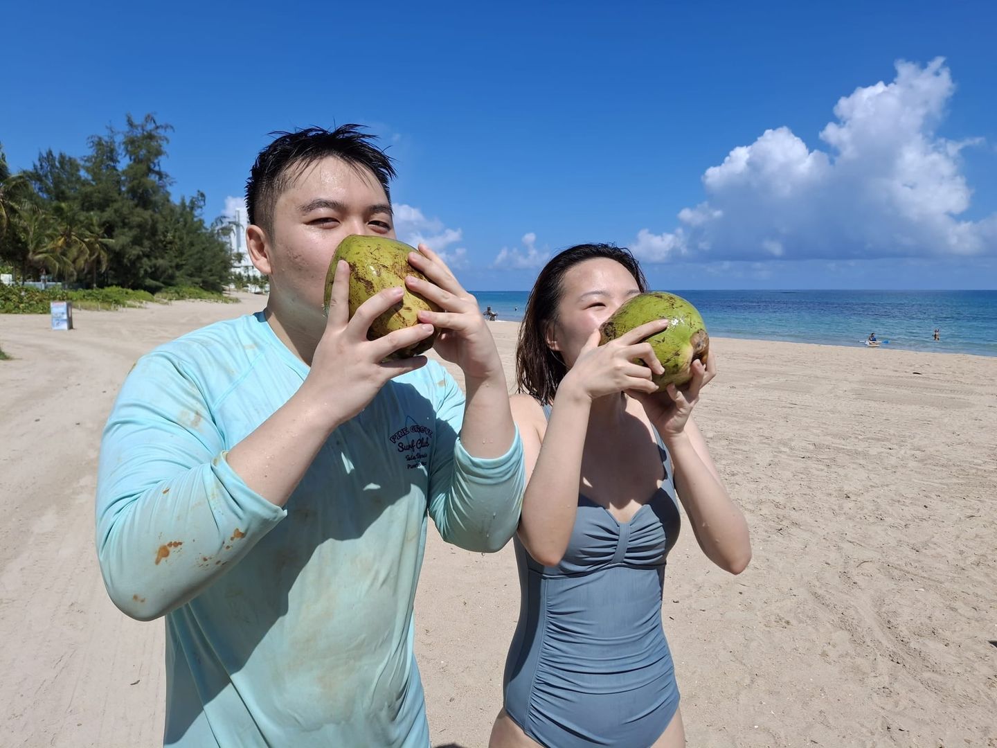 Couple drinking coconut