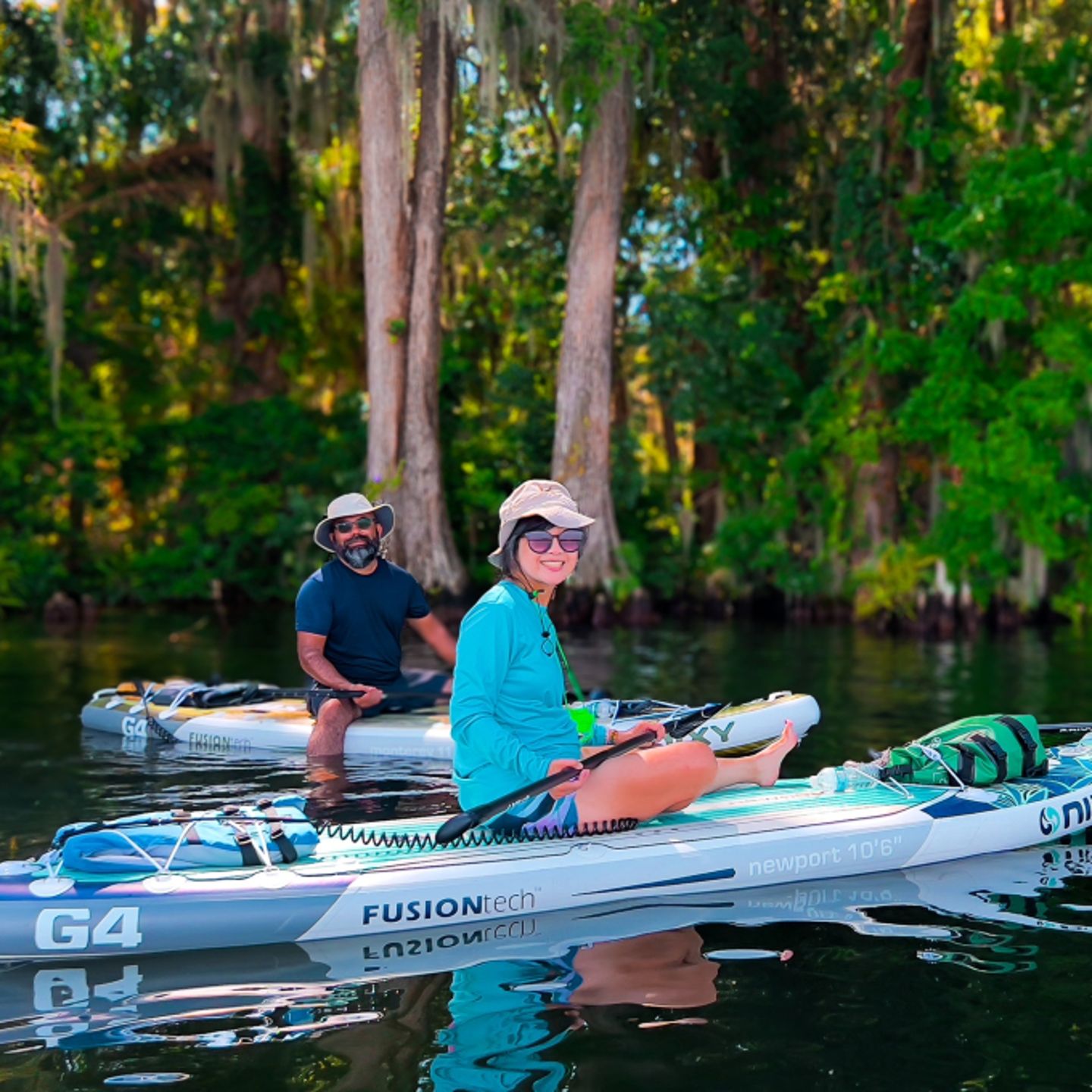 People sitting on paddleboard