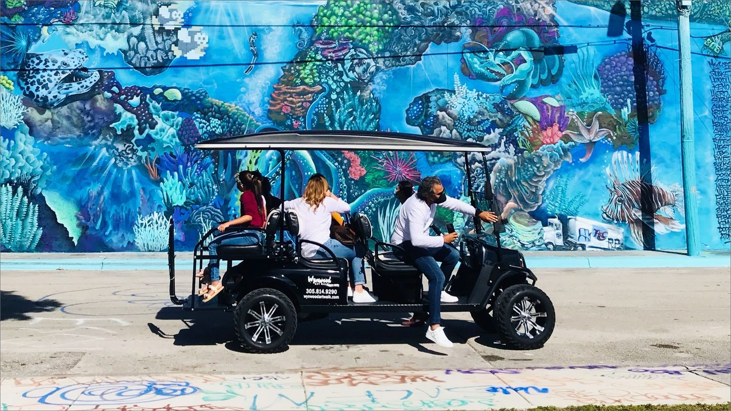 Group on golf cart