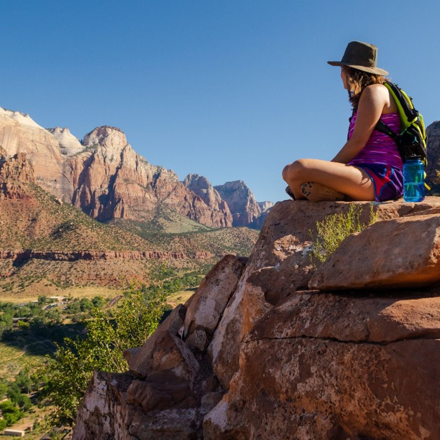 Woman sitting on rock