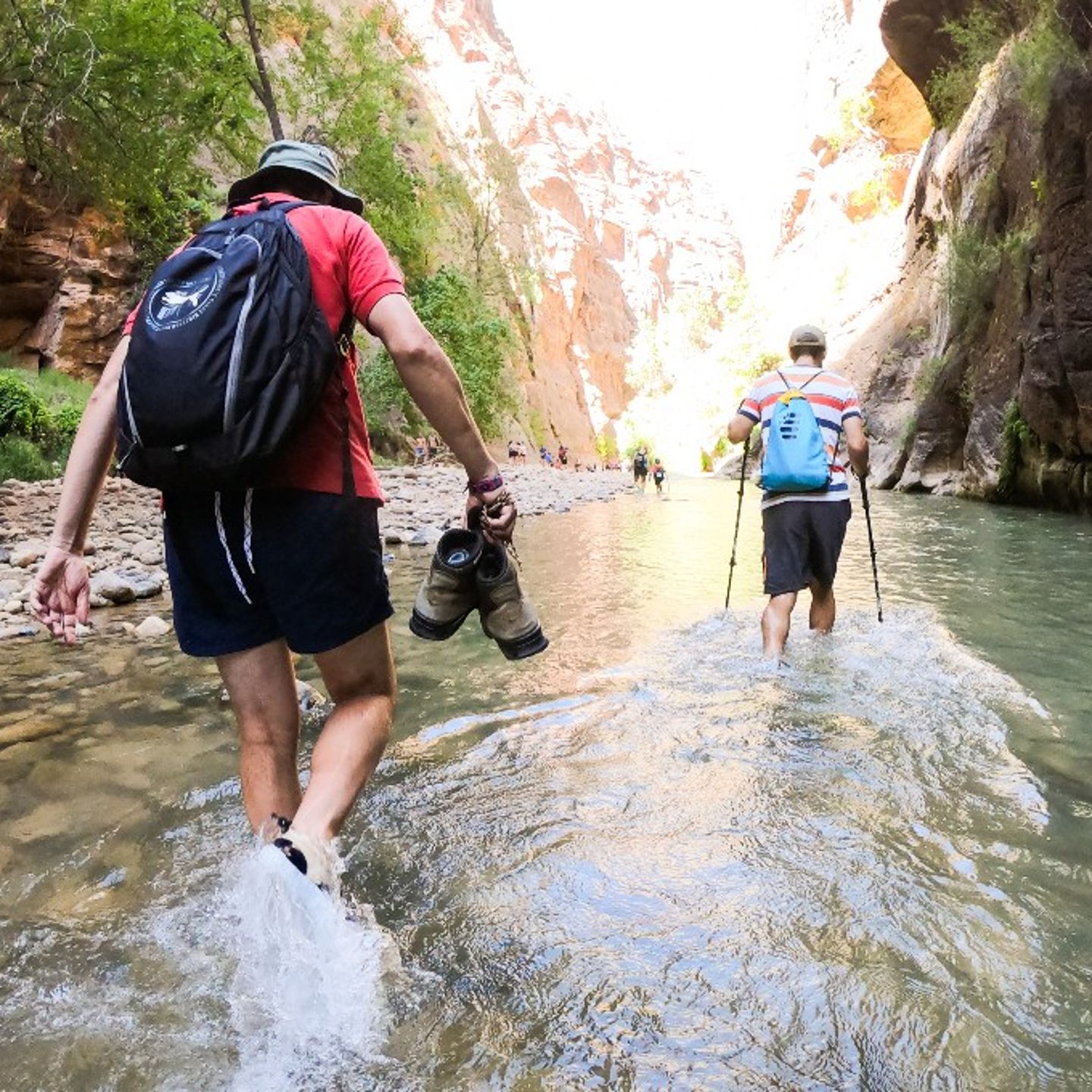 People hiking through water