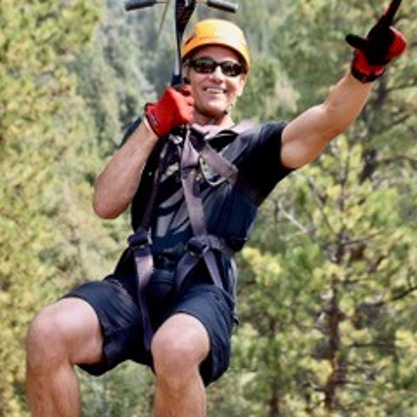 Man on zipline up close