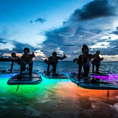 Nighttime Stand-Up Paddleboard Yoga Class